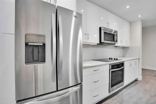 207-20 Brentwood Common Nw, Calgary, AB - Indoor Photo Showing Kitchen With Upgraded Kitchen