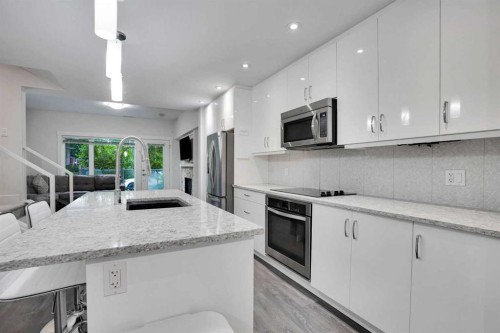 207-20 Brentwood Common Nw, Calgary, AB - Indoor Photo Showing Kitchen With Upgraded Kitchen