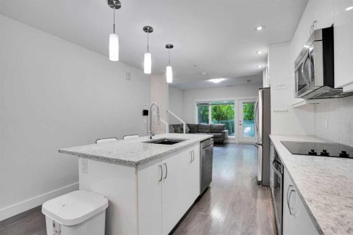 207-20 Brentwood Common Nw, Calgary, AB - Indoor Photo Showing Kitchen With Upgraded Kitchen