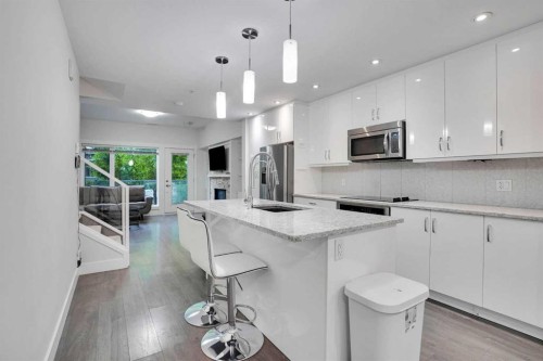 207-20 Brentwood Common Nw, Calgary, AB - Indoor Photo Showing Kitchen With Upgraded Kitchen