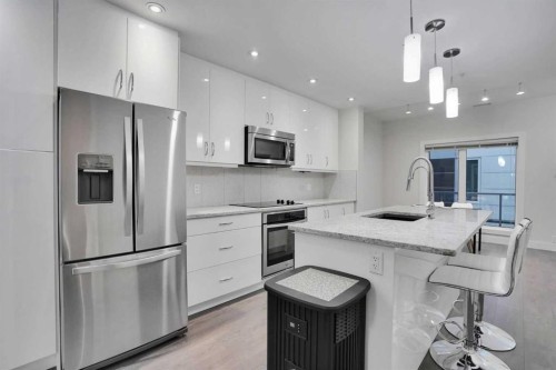207-20 Brentwood Common Nw, Calgary, AB - Indoor Photo Showing Kitchen With Upgraded Kitchen