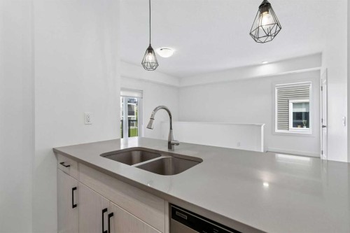 1001-24 Rivercrest Drive, Cochrane, AB - Indoor Photo Showing Kitchen With Double Sink