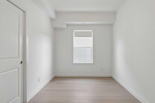 1001-24 Rivercrest Drive, Cochrane, AB - Indoor Photo Showing Other Room