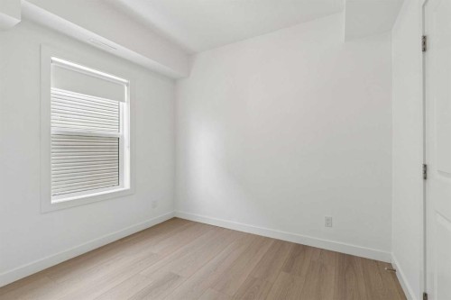 1001-24 Rivercrest Drive, Cochrane, AB - Indoor Photo Showing Other Room