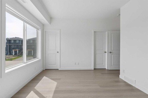 1001-24 Rivercrest Drive, Cochrane, AB - Indoor Photo Showing Other Room