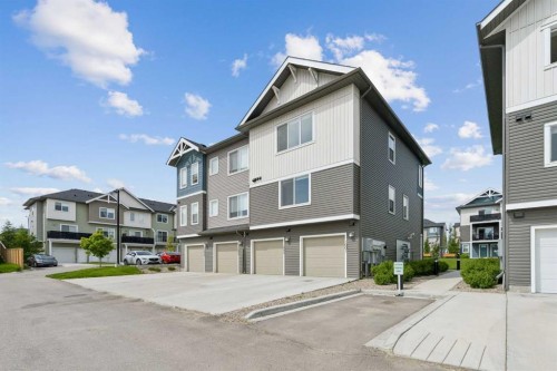 1001-24 Rivercrest Drive, Cochrane, AB - Outdoor With Facade