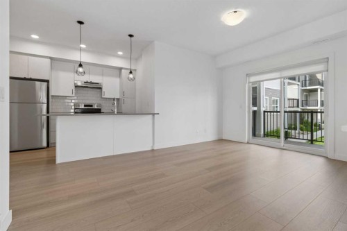 1001-24 Rivercrest Drive, Cochrane, AB - Indoor Photo Showing Kitchen With Stainless Steel Kitchen With Upgraded Kitchen