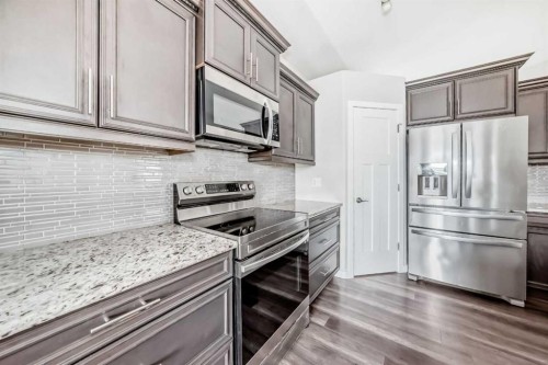 110 Cedar Square, Blackfalds, AB - Indoor Photo Showing Kitchen With Upgraded Kitchen
