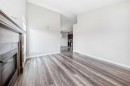 110 Cedar Square, Blackfalds, AB  - Indoor With Fireplace 