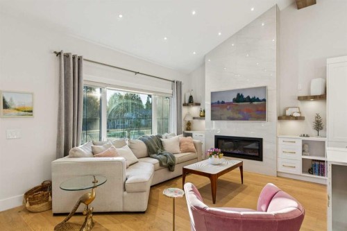 16 Calandar Road Nw, Calgary, AB - Indoor Photo Showing Living Room With Fireplace