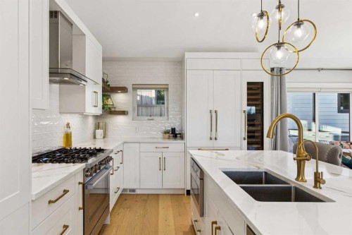 16 Calandar Road Nw, Calgary, AB - Indoor Photo Showing Kitchen With Double Sink With Upgraded Kitchen