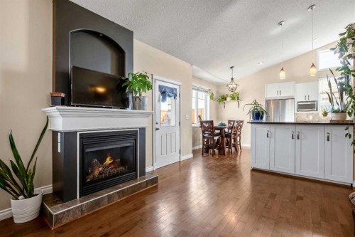 336 Butte Place, Stavely, AB - Indoor Photo Showing Living Room With Fireplace