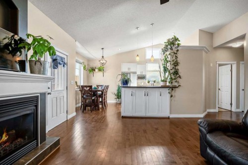 336 Butte Place, Stavely, AB - Indoor Photo Showing Living Room With Fireplace