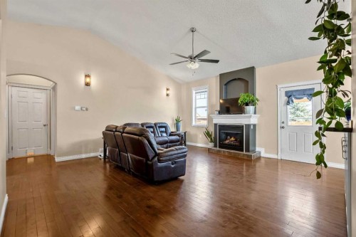 336 Butte Place, Stavely, AB - Indoor Photo Showing Living Room With Fireplace