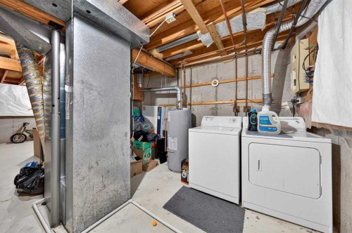 538 Woodbine Boulevard Sw, Calgary, AB - Indoor Photo Showing Laundry Room