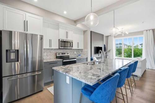 332 Lawthorn Way Se, Airdrie, AB - Indoor Photo Showing Kitchen With Double Sink With Upgraded Kitchen