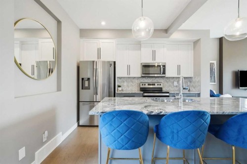 332 Lawthorn Way Se, Airdrie, AB - Indoor Photo Showing Kitchen With Upgraded Kitchen