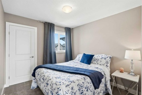 332 Lawthorn Way Se, Airdrie, AB - Indoor Photo Showing Bedroom
