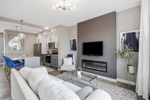 332 Lawthorn Way Se, Airdrie, AB - Indoor Photo Showing Living Room With Fireplace