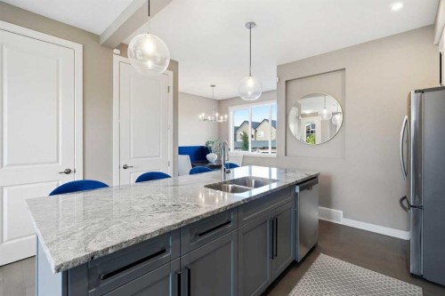 332 Lawthorn Way Se, Airdrie, AB - Indoor Photo Showing Kitchen With Double Sink With Upgraded Kitchen
