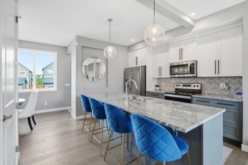 332 Lawthorn Way Se, Airdrie, AB - Indoor Photo Showing Kitchen With Upgraded Kitchen