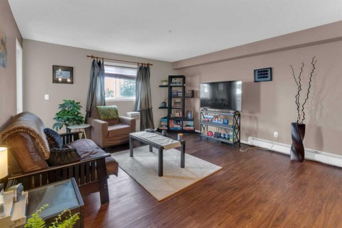 1310-4975 130 Avenue Se, Calgary, AB - Indoor Photo Showing Living Room
