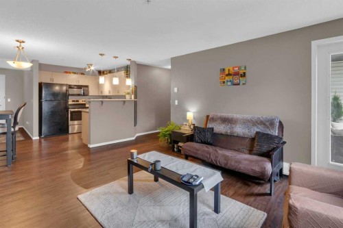 1310-4975 130 Avenue Se, Calgary, AB - Indoor Photo Showing Living Room