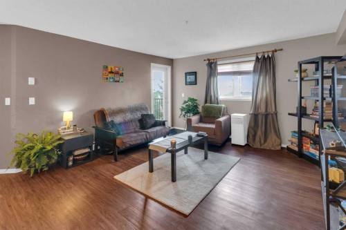 1310-4975 130 Avenue Se, Calgary, AB - Indoor Photo Showing Living Room