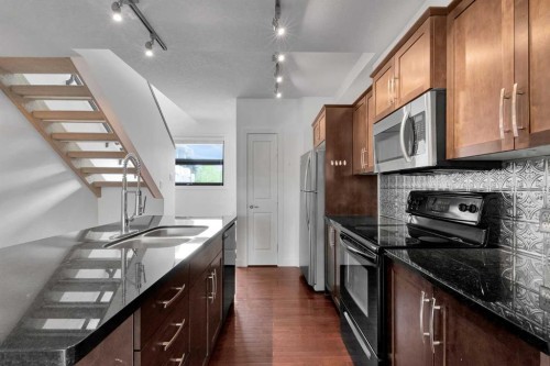 55 Aspen Hill Green Sw, Calgary, AB - Indoor Photo Showing Kitchen With Double Sink