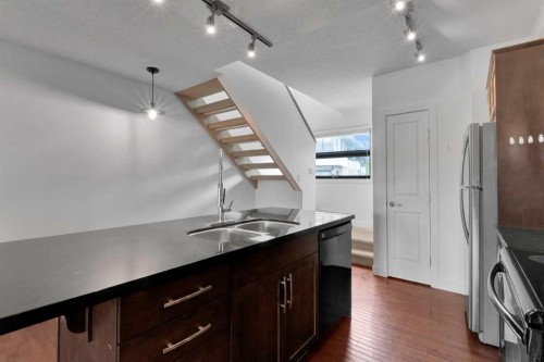 55 Aspen Hill Green Sw, Calgary, AB - Indoor Photo Showing Kitchen With Double Sink