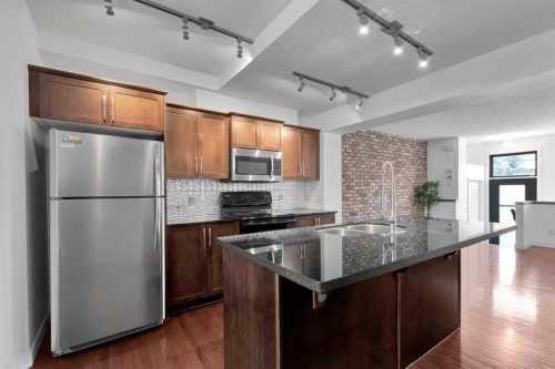 55 Aspen Hill Green Sw, Calgary, AB - Indoor Photo Showing Kitchen With Double Sink With Upgraded Kitchen