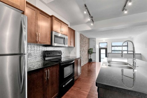 55 Aspen Hill Green Sw, Calgary, AB - Indoor Photo Showing Kitchen With Double Sink