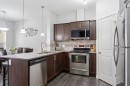 126 Copperpond Landing Se, Calgary, AB  - Indoor Photo Showing Kitchen With Stainless Steel Kitchen With Upgraded Kitchen 