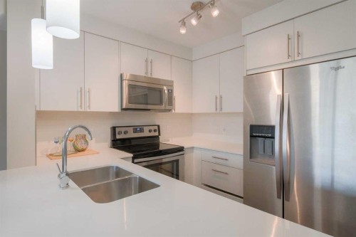 6305-302 Skyview Ranch Drive Ne, Calgary, AB - Indoor Photo Showing Kitchen With Stainless Steel Kitchen With Double Sink With Upgraded Kitchen
