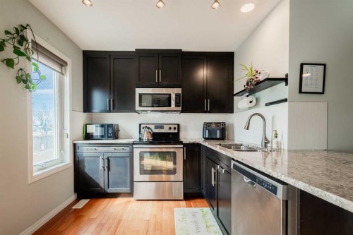 1310 Auburn Bay Square Se, Calgary, AB - Indoor Photo Showing Kitchen With Stainless Steel Kitchen With Double Sink With Upgraded Kitchen