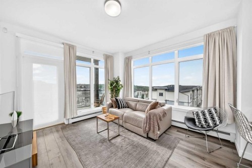 316-205 Spring Creek Common Sw, Calgary, AB - Indoor Photo Showing Living Room