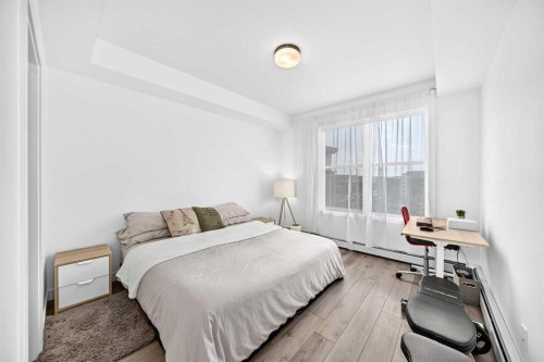 316-205 Spring Creek Common Sw, Calgary, AB - Indoor Photo Showing Bedroom