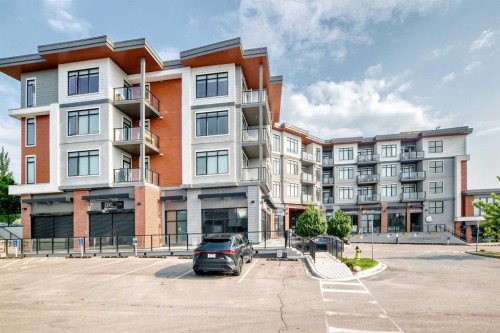 316-205 Spring Creek Common Sw, Calgary, AB - Outdoor With Balcony With Facade