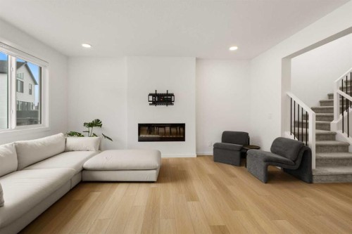 50 Royston Terrace Nw, Calgary, AB - Indoor Photo Showing Other Room With Fireplace