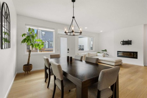 50 Royston Terrace Nw, Calgary, AB - Indoor Photo Showing Other Room With Fireplace