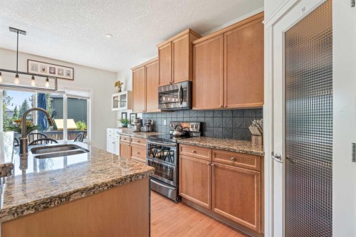 7 Crystal Green Way, Okotoks, AB - Indoor Photo Showing Kitchen With Double Sink