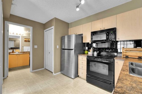 716-1111 6 Avenue Sw, Calgary, AB - Indoor Photo Showing Kitchen With Double Sink