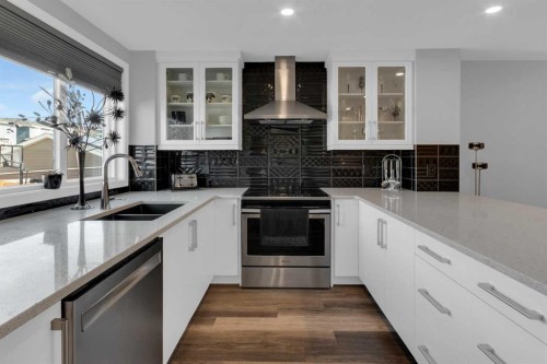 317 Sundown Road South, Cochrane, AB - Indoor Photo Showing Kitchen With Double Sink With Upgraded Kitchen