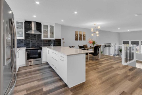 317 Sundown Road South, Cochrane, AB - Indoor Photo Showing Kitchen With Upgraded Kitchen