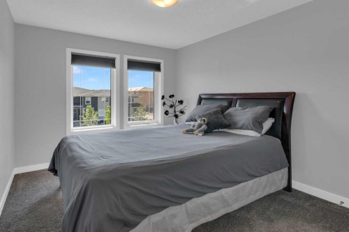 317 Sundown Road South, Cochrane, AB - Indoor Photo Showing Bedroom