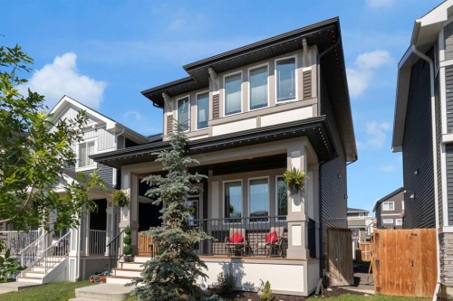 317 Sundown Road South, Cochrane, AB - Outdoor With Deck Patio Veranda With Facade