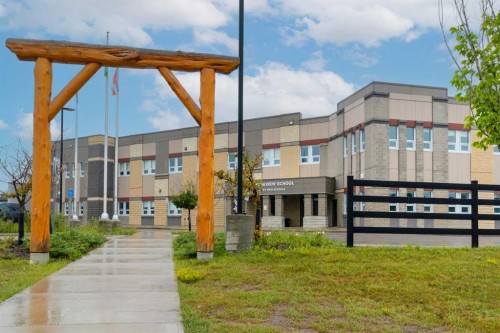 317 Sundown Road South, Cochrane, AB - Outdoor With Facade