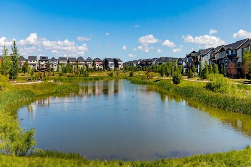 317 Sundown Road South, Cochrane, AB - Outdoor With Body Of Water With View