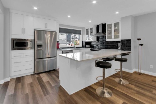 317 Sundown Road South, Cochrane, AB - Indoor Photo Showing Kitchen With Stainless Steel Kitchen With Upgraded Kitchen