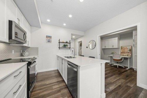 224-255 Les Jardins Park Se, Calgary, AB - Indoor Photo Showing Kitchen With Double Sink With Upgraded Kitchen